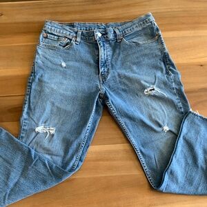 Levi’s 511 distressed ankle jeans